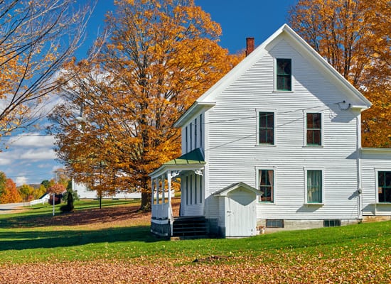 White house with autumn foliage